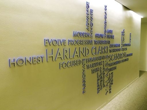 metal faced acrylic in brushed aluminum on blue painted acrylic feature wall