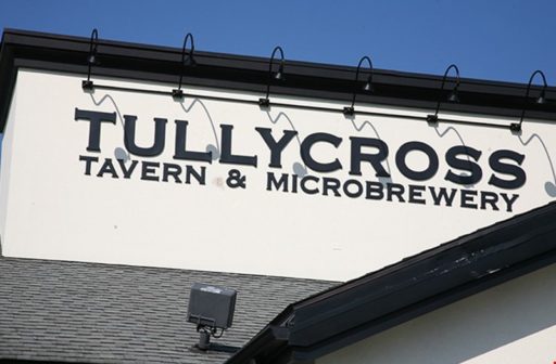 black formed plastic letters in copperplate font outside restaurant and brewery