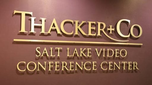 metal faced brushed brass laminate letters on interior business lobby wall