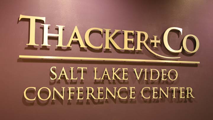 metal faced brushed brass laminate letters on interior business lobby wall