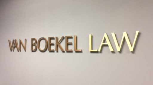 solid cut brushed brass letters for law firm interior lobby wall