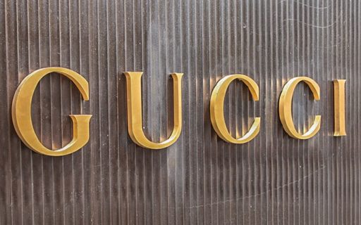 Gold Anodized Aluminum Letters mounted on corrugated siding for gucci retail store