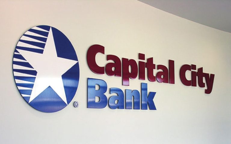 painted solid cut aluminum letters with white vinyl logo for bank lobby wall