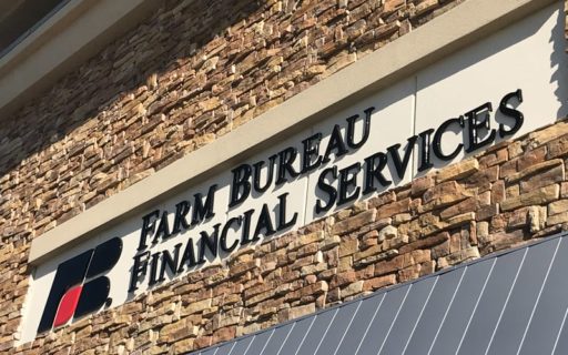 formed plastic letters and custom logo in glossy black and red mounted outside