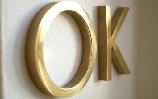solid brass letters in polished mirror finish closeup flush mounted