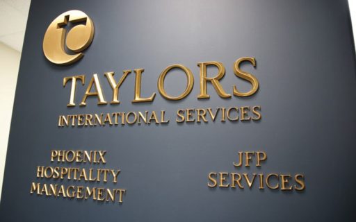 cast bronze letters in polished prismatic beveled face for lobby wall