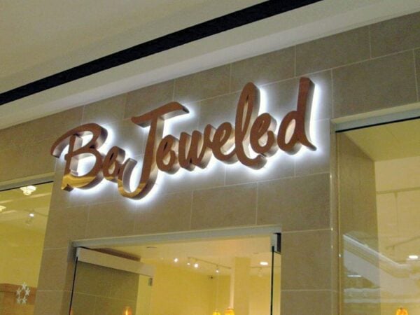 Brushed copper halo-lit backlit letters with cool white LEDs — Bejeweled, mall retail