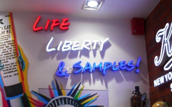 Neon channel letters in white, blue, and red LED neon — Kiehl's storefront