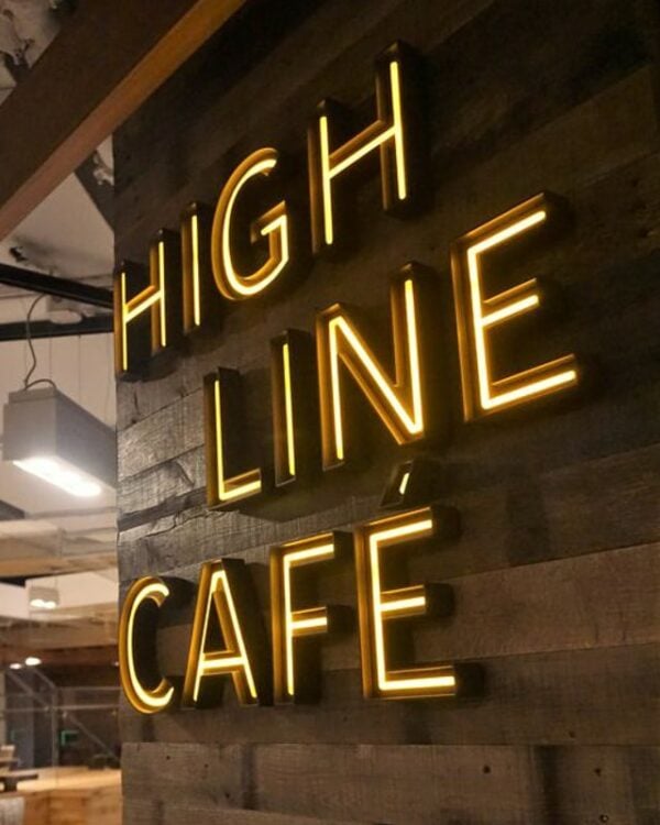 LED acrylic neon channel letters mounted on a wall — Highline