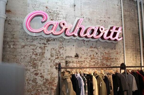 Pink open-face LED neon store sign — Carhartt retail storefront