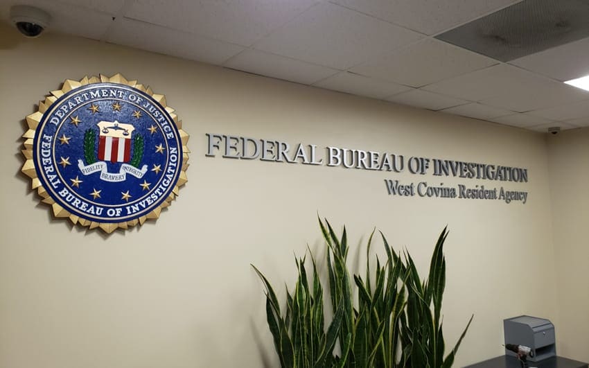 Carved FBI Seal and Lettering mounted on inside lobby wall