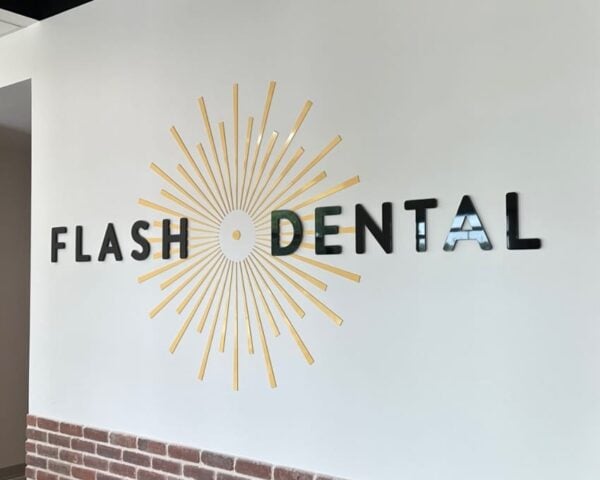 Pigmented black acrylic dimensional letters — Flash Dental reception