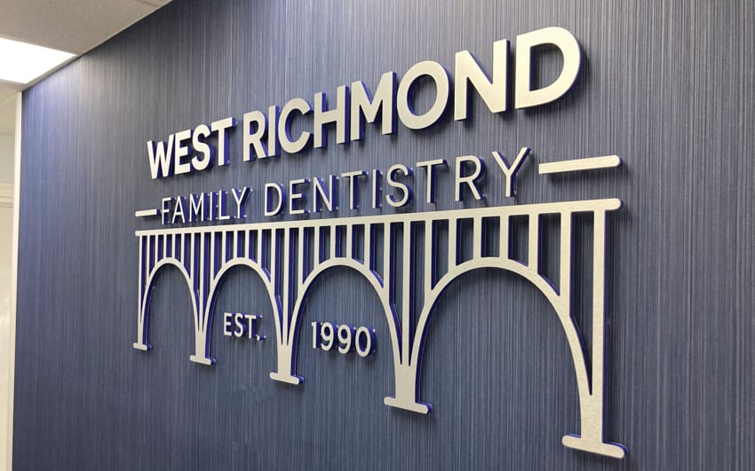 Metal-faced acrylic interior letters — brushed aluminum with blue acrylic, West Richmond