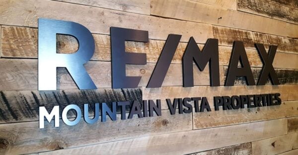 Metal Faced Acrylic brushed black logo - Remax Lobby