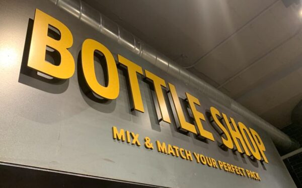 Gold painted solid aluminum storefront letters — bottle shop exterior