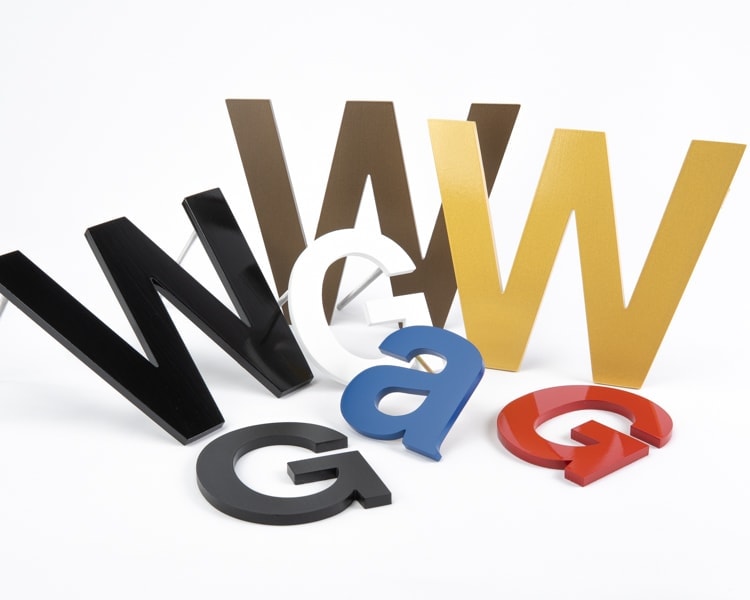 Grouping of painted solid aluminum sign letters