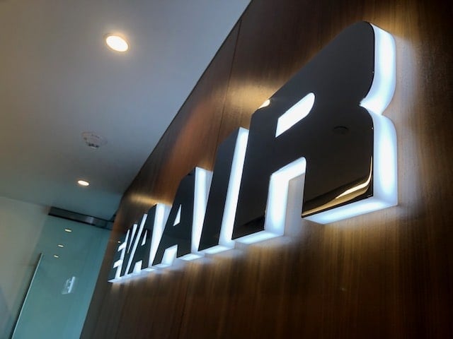 Acrylic backlit edge-lit letters with metal face — EVA Air reception sign