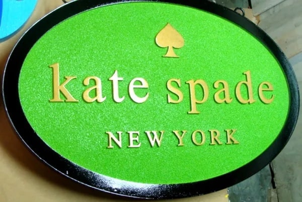 Carved HDU dimensional store sign — Kate Spade storefront