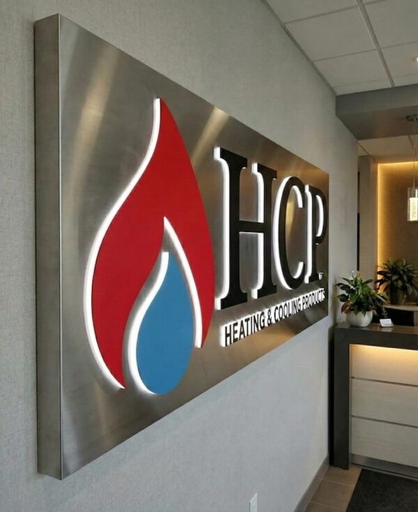Illuminated push through letters in an stainless steel cabinet sign — HCP