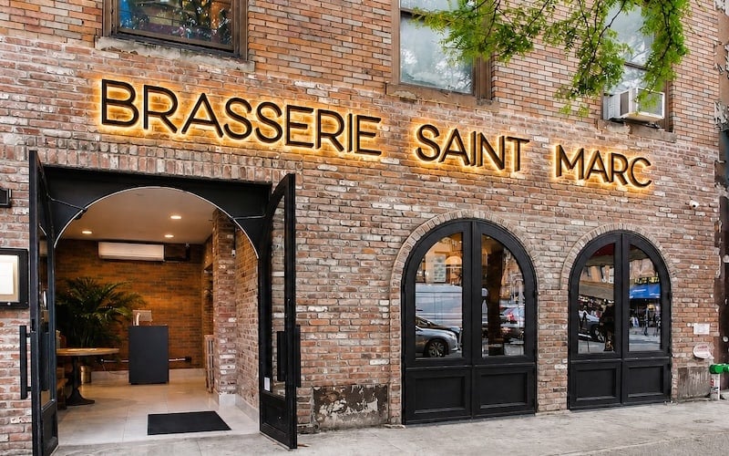 painted matte black backlit letters with warm white leds on restaurant exterior - saint marc
