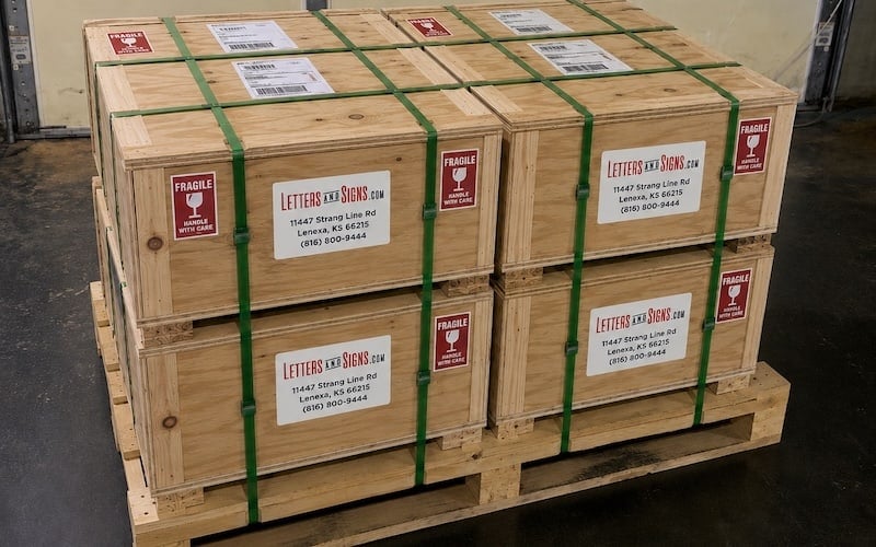 Lucchese exterior signs packaged individually for shipment to multiple locations