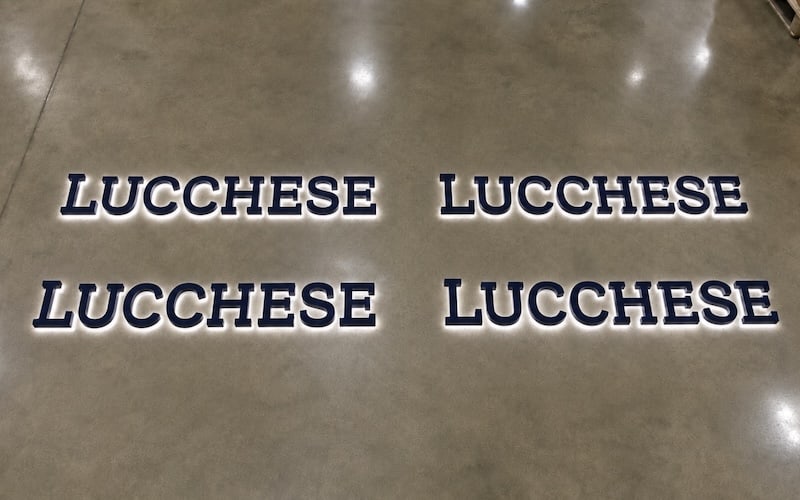 Multiple matching Lucchese exterior building signs fabricated together on the shop floor